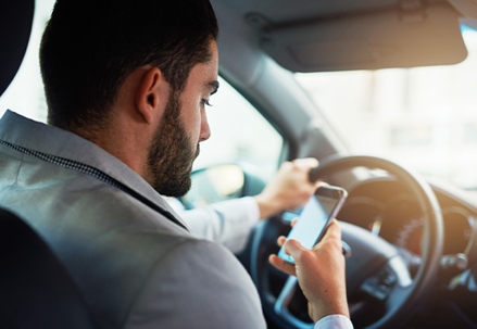 Person using phone while driving